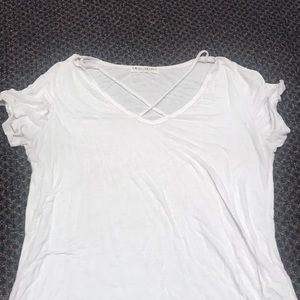 White tee with criss cross straps across chest L